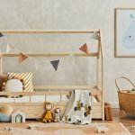 Stylish composition of cozy scandinavian child’s room interior w